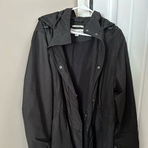Black ladies raincoat in good shape. Snaps or zips, hooded also!